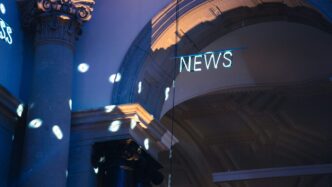 a building with a sign on the roof