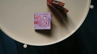 100 banknote on white round table