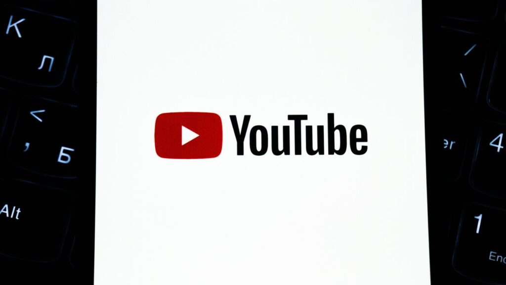 Youtube logo on a white background with keyboard.