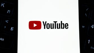 Youtube logo on a white background with keyboard.