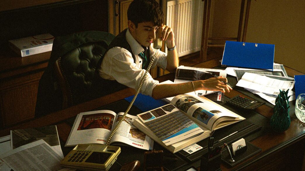 A person sitting at a desk with a laptop