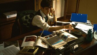 A person sitting at a desk with a laptop
