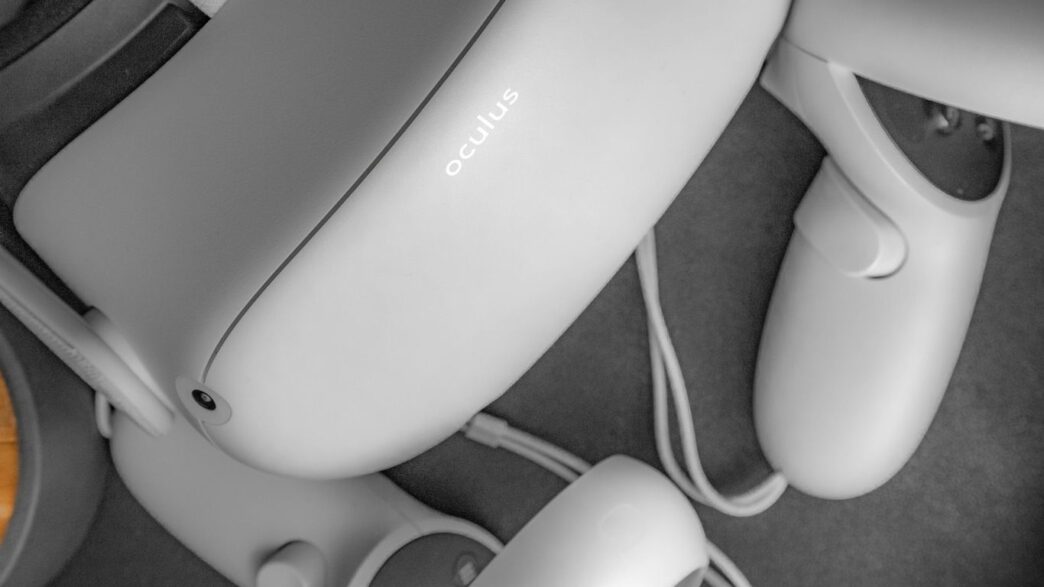 white samsung corded headphones on white textile