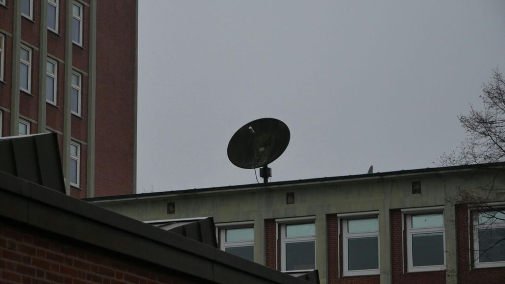 a satellite dish sitting on top of a building