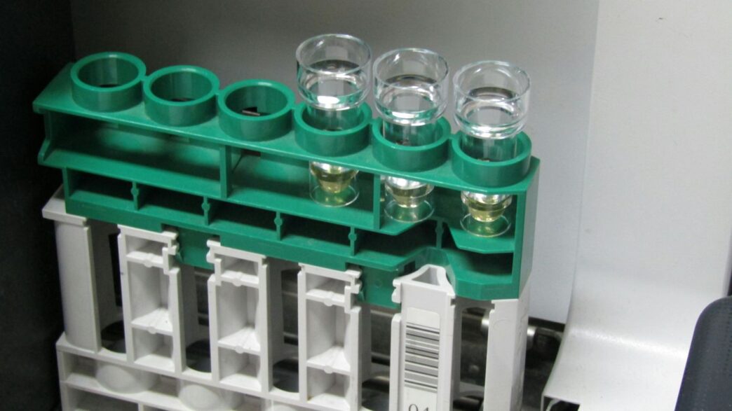 green plastic container on green plastic rack