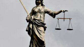 A statue of lady justice holding a sword and a scale