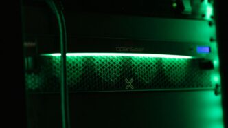 a close up of a green light in a server