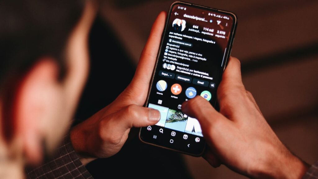 A man holding a cell phone up to his face