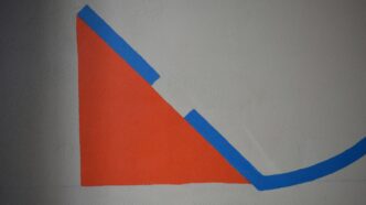 a drawing of a triangle on a white wall