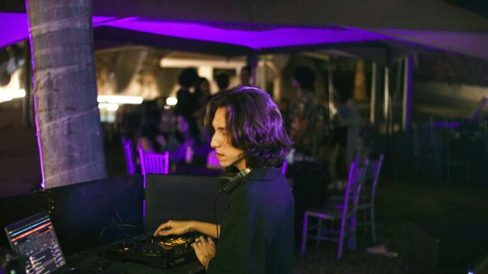 A woman sitting at a table with a laptop