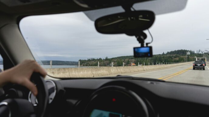 a person driving a car on a highway