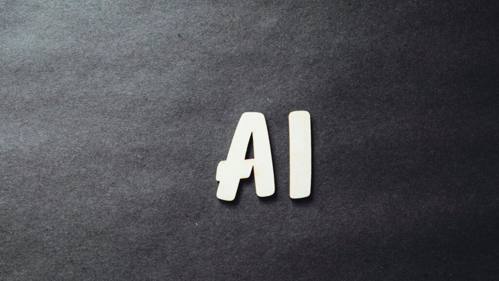 the word ai spelled in white letters on a black surface