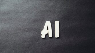the word ai spelled in white letters on a black surface