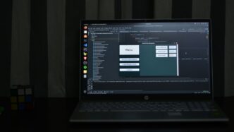 black hp laptop computer turned on displaying desktop