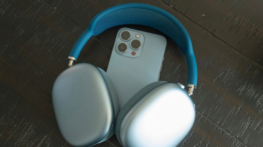 a pair of headphones sitting next to an iphone