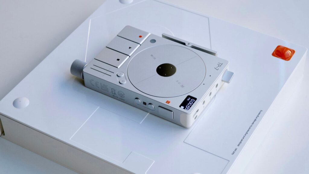a white electronic device sitting on top of a white table