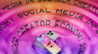 A cell phone sitting on top of a purple circle