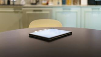 A table with a cell phone on top of it