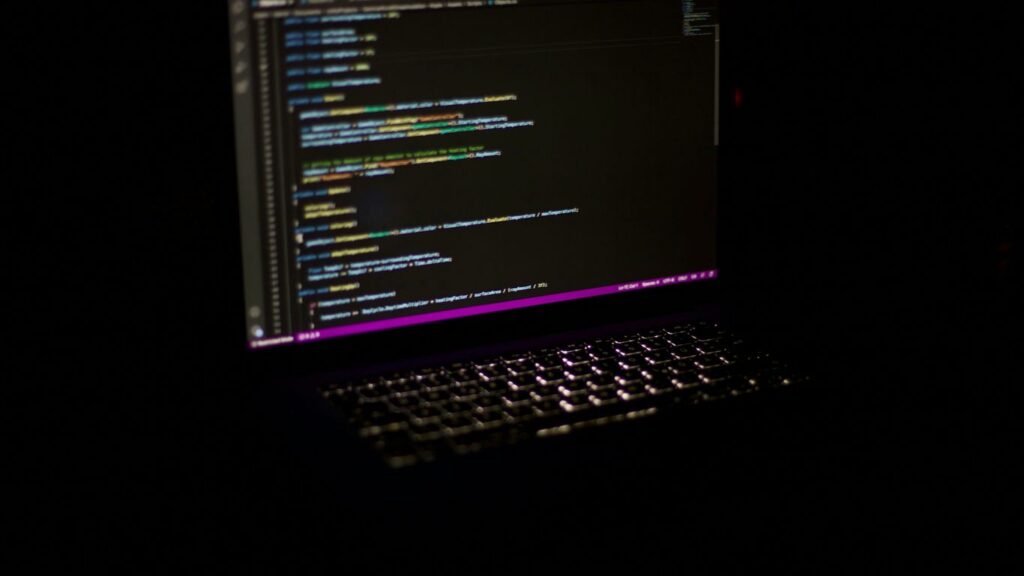 a laptop computer sitting on top of a table