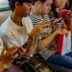 people using smartphones while sitting inside train