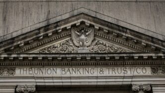 brown concrete building with statue