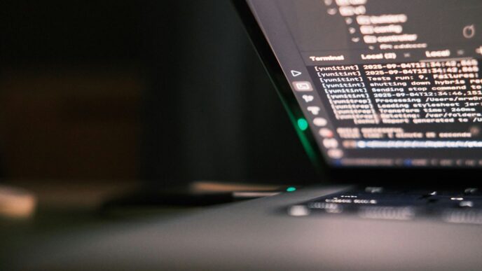 Laptop screen displaying lines of code