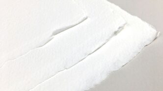 a piece of white paper with a hole in it