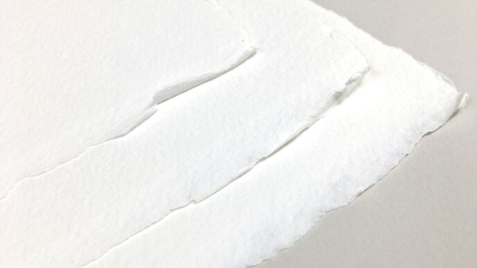 a piece of white paper with a hole in it