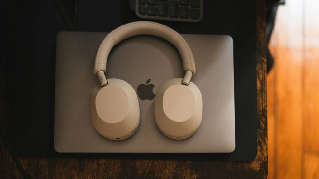 a pair of headphones sitting on top of a mouse pad