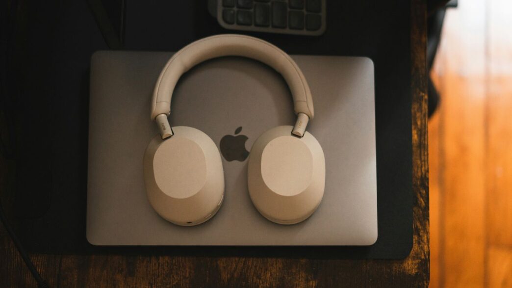 a pair of headphones sitting on top of a mouse pad