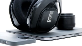 a pair of headphones sitting on top of a tablet