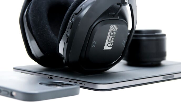 a pair of headphones sitting on top of a tablet