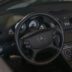 Mercedes-benz car interior with leather steering wheel.