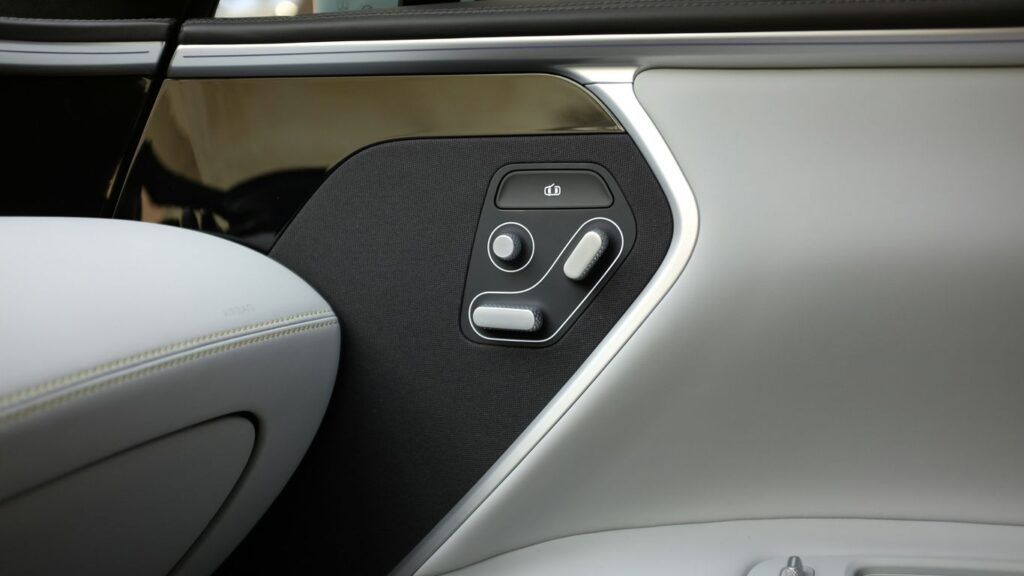 a close up of a car door with a button