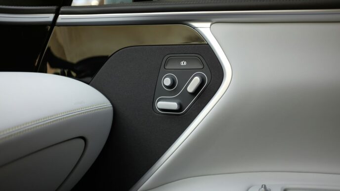 a close up of a car door with a button