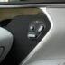 a close up of a car door with a button
