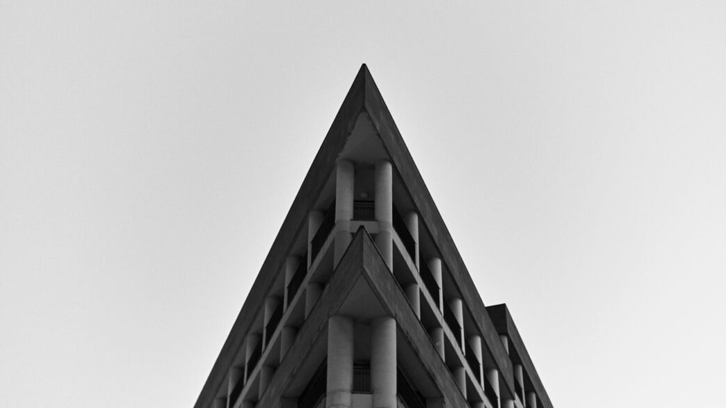 a black and white photo of a tall building