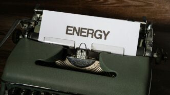 a close up of a typewriter with a sign on it