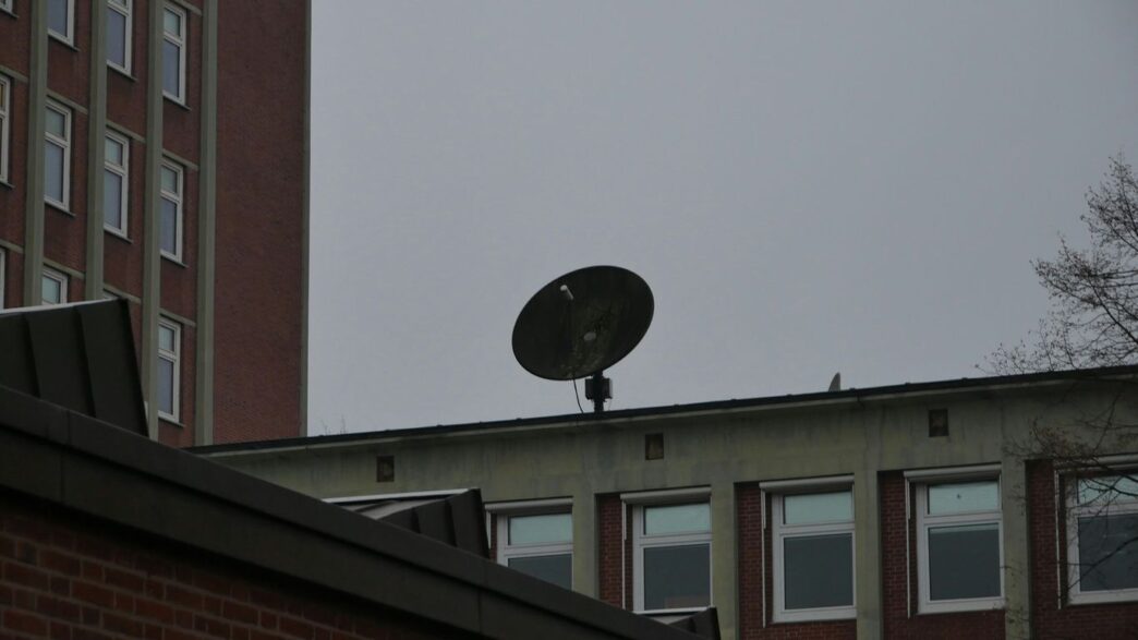 a satellite dish sitting on top of a building