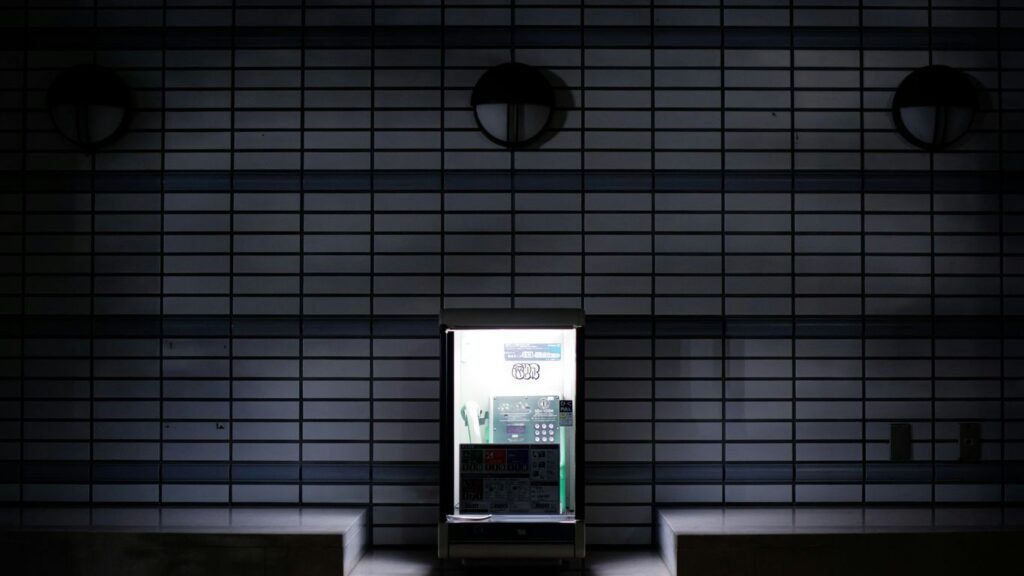 A bright doorway amidst a dark building.