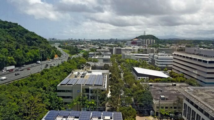 an aerial view of a city with solar panels
