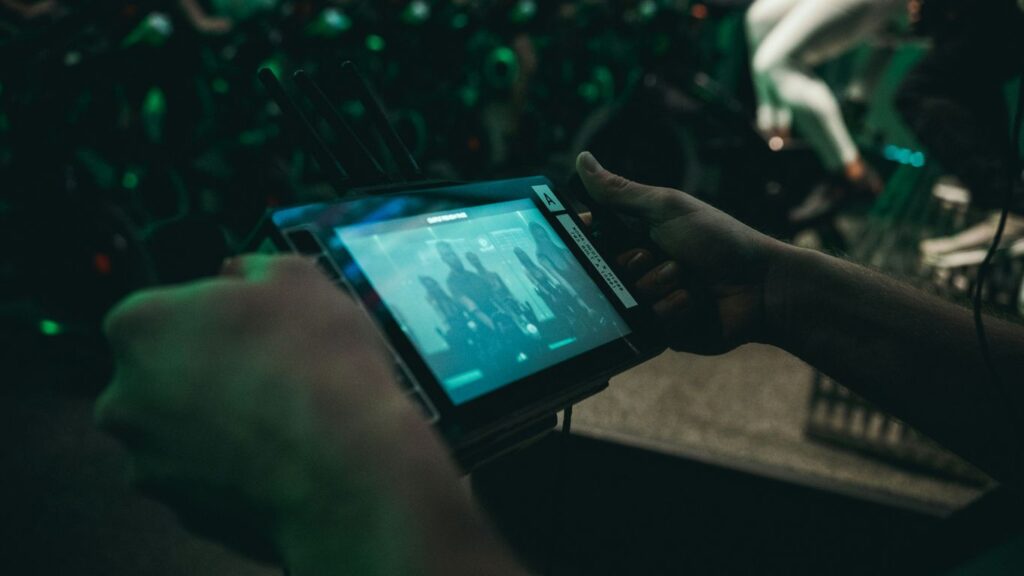 person playing with black handheld game console
