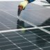 a person working on a solar panel