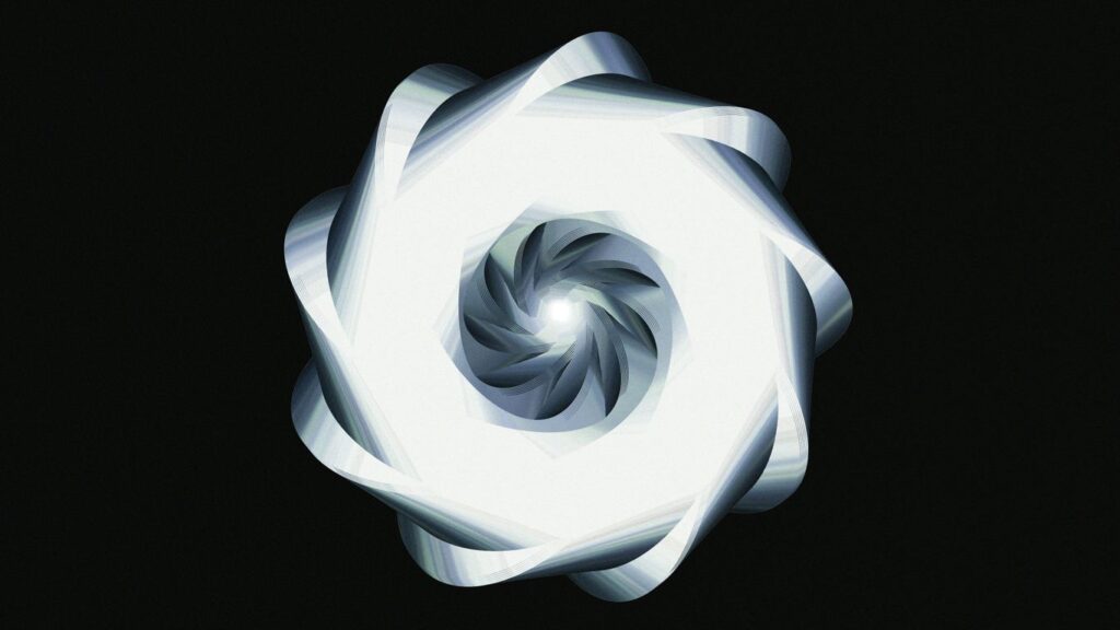 A luminous, spiraling design against black.