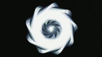 A luminous, spiraling design against black.