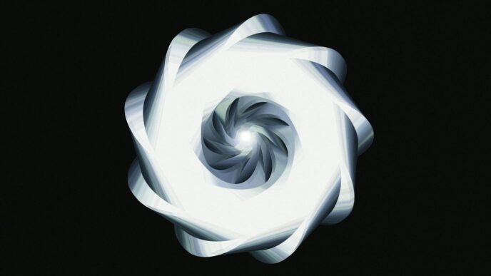 A luminous, spiraling design against black.