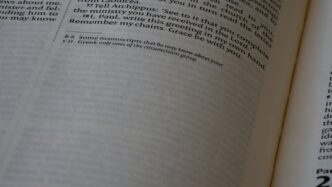 A close up of an open book with numbers on it