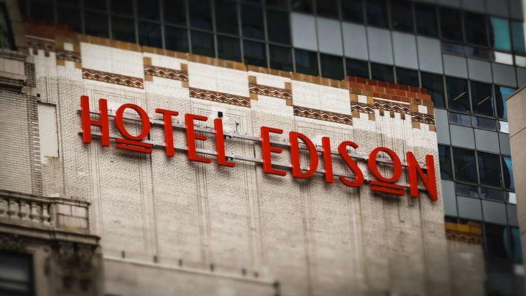 The hotel edison sign is displayed on a building.