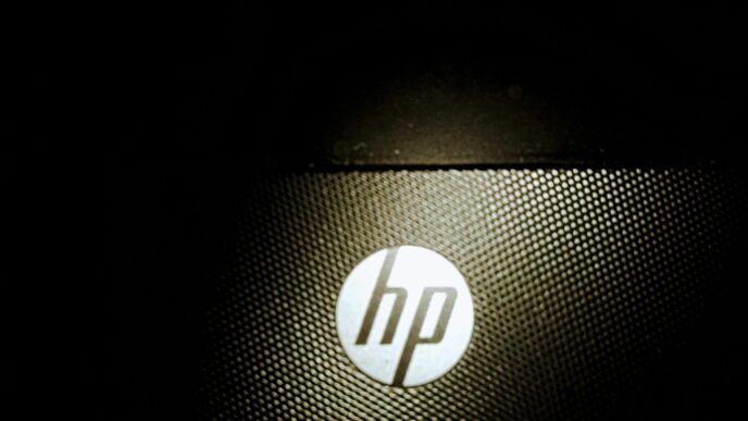 a close up of a hp logo on a laptop