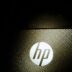 a close up of a hp logo on a laptop